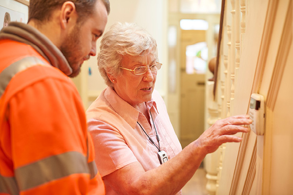 Installer trains elderly woman to use her security system