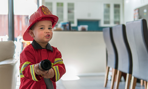 Little boy pretends to be fireman