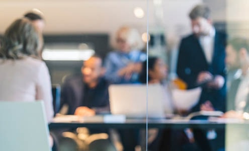 Business men and women in a meeting