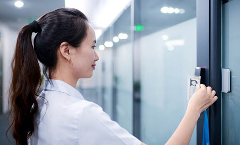 Employee using her key fob for entrance