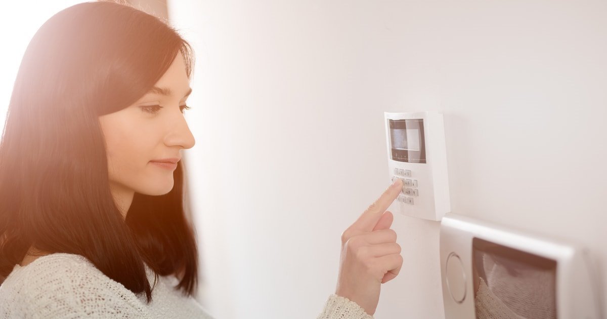 woman-entering-alarm-code-min